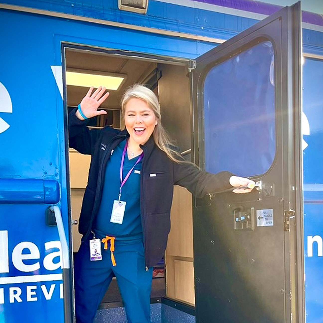 Image of mobile Family Medicine Cares USA clinic and relief volunteer.